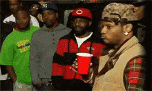 Man looking skeptically around a group